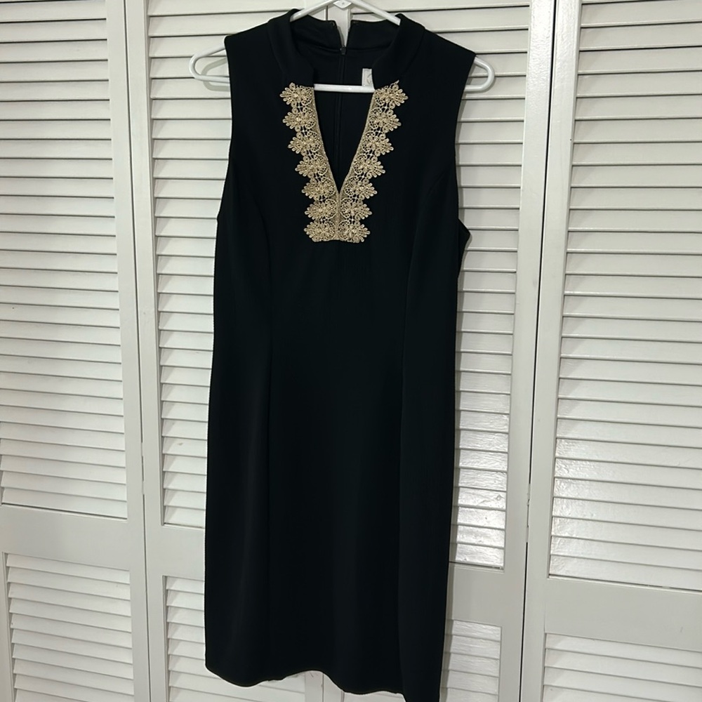 This is the dress for you! Beautiful design black and gold!